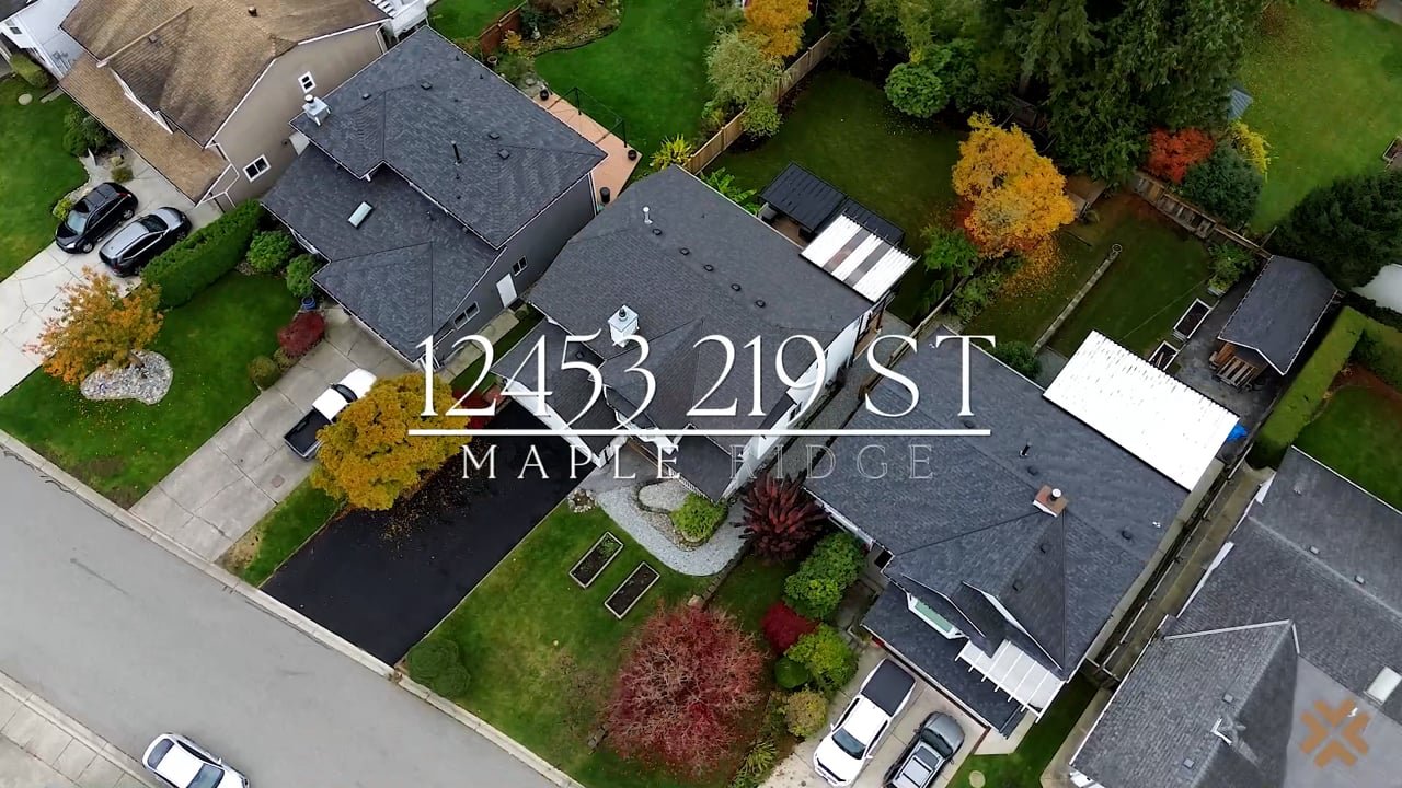 Aerial drone shot of a two-storey home at 12453 219 St, Maple Ridge